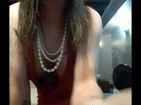 Jade in a red halter dress pleasing hurself to climax