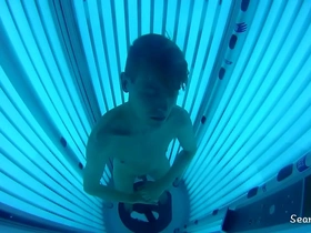 Sexy jock at the tanning booth