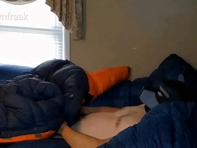 Humping big orange parka on puffy bed of down